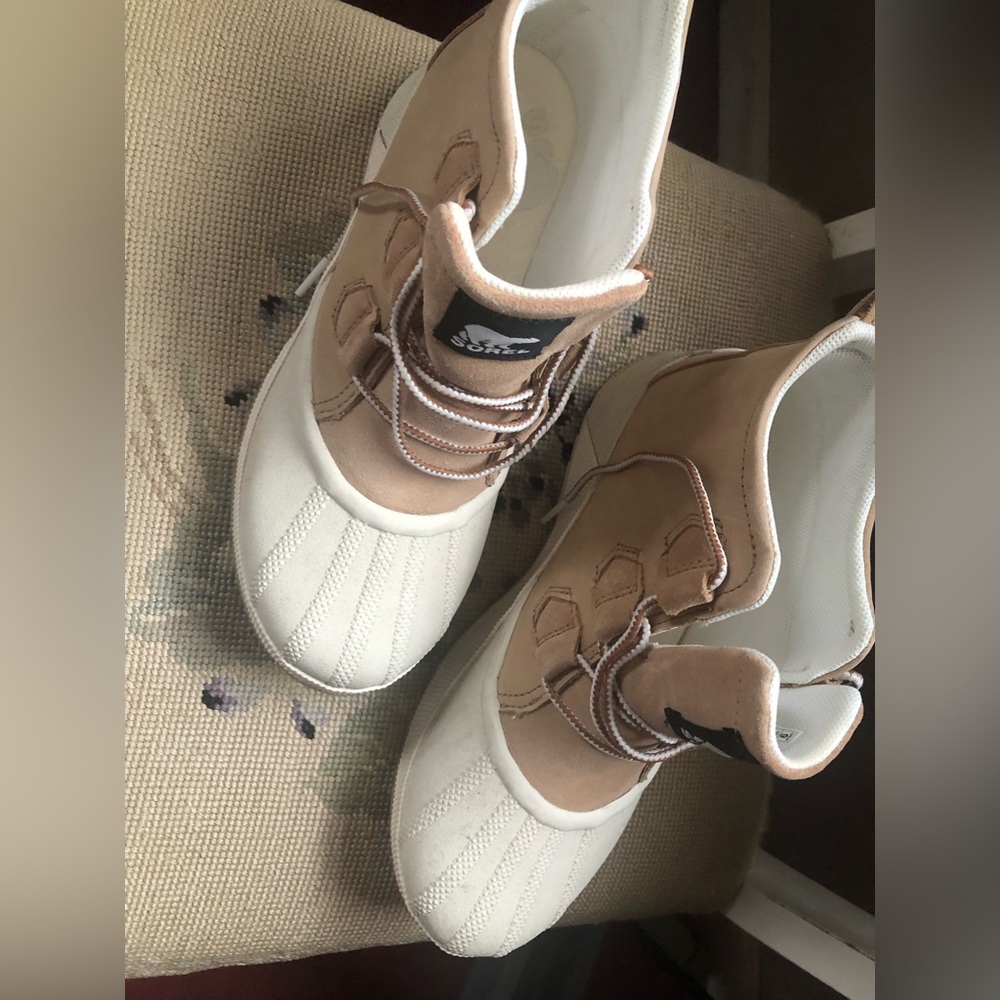 Sorel water proof booties. Worn once then had foot surgery.  No longer fit.